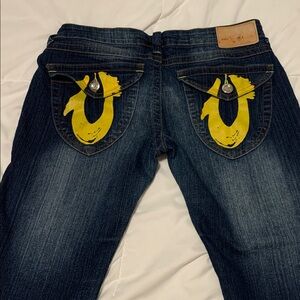 Preowned Vintage True Religion Yellow Pain Horseshoe Pockets Blue Jeans Size 28